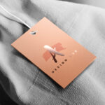 Spot UV Hang Tags | Print square or rectangular shaped tags with Premium Gloss paper With Tear and scratch-resistant Spot UV Hang Tags And Spot UV coating adds durability for long-lasting use | PrintMagic